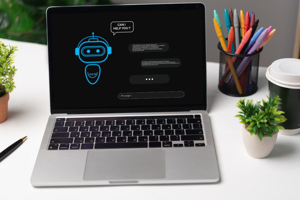 Labtop mit Bildschirm auf dem ein Chat-Bot visualisiert wird - Symbolbild für die AI Masterclass.