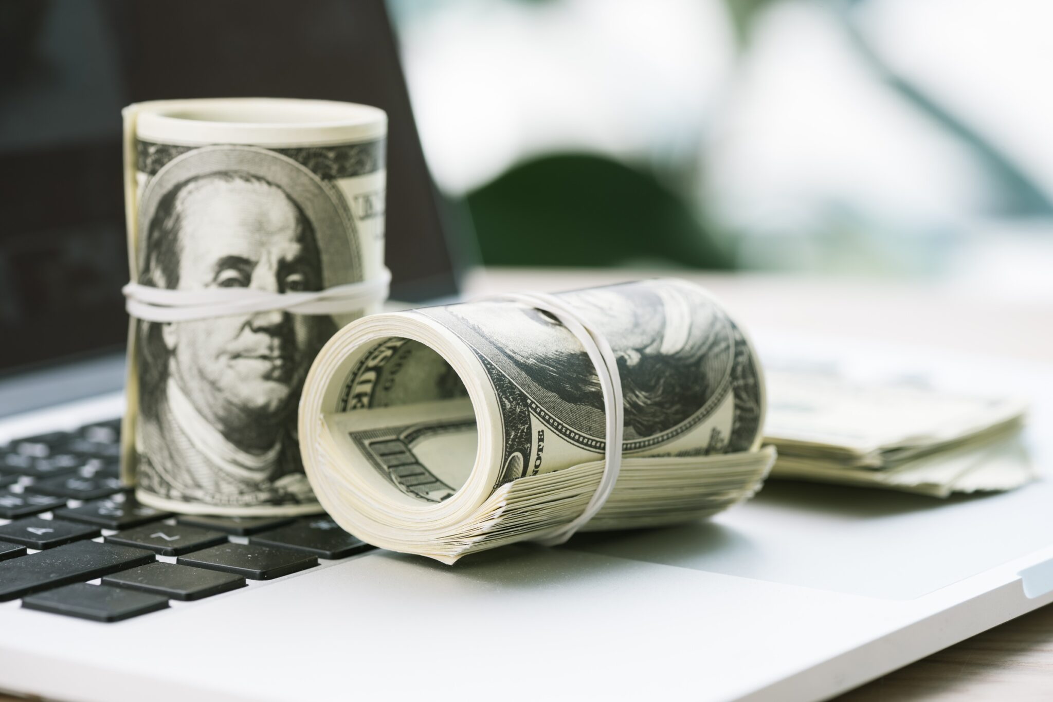 selective focus of rolled dollar banknotes on open 2026 01 06 00 44 59 utc scaled